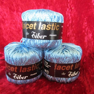 May include: Three spools of blue elastic lace yarn, each with a black label that reads "Lacet Lastique de Eilber France".