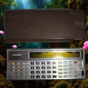 May include: A vintage Sharp EL-5100 scientific calculator with a silver body and black keys. The calculator has a digital display and is accompanied by a brown protective case. The brand name "SHARP" is visible on the calculator.