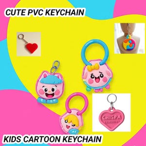 Può includere: Una collezione di portachiavi in PVC colorati. I portachiavi presentano personaggi e forme di cartoni animati, tra cui un cuore, un gatto, un cane, una ragazza e un pezzo di puzzle. Il testo "CUTE PVC KEYCHAIN" e "KIDS CARTOON KEYCHAIN" sono visualizzati.
