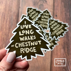 May include: A brown tree-shaped sticker with the text "I love long walks at Chestnut Ridge" in white lettering.