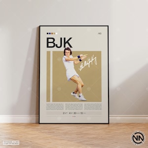 May include: A framed poster featuring a tennis player in action, wearing a white outfit with blue accents. The poster includes the initials "BJK", a signature, and text at the bottom. The background is tan with vertical white stripes.