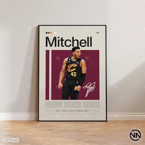 May include: A framed poster featuring a basketball player in a black and gold uniform with the number 45. The player's name, "Mitchell," is displayed in large text above his image. The poster includes a signature and text at the bottom.