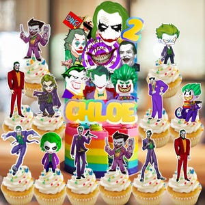 May include: A birthday cake and cupcakes decorated with Joker-themed toppers. The cake is rainbow-colored with the name "Chloe" and a number "2". Cupcakes have white frosting and colorful sprinkles. Various Joker character images are displayed.