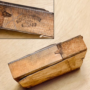 May include: A wooden box with a label that reads "Meyer & Son, Inc. Chicago". The box is made of light brown wood and has a dark brown stain on the top.