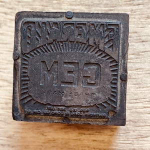 May include: A black rubber stamp with the words "GEM" and "TRADE MARK" in a circular design. The words "EXCELLENT" are above the circle.