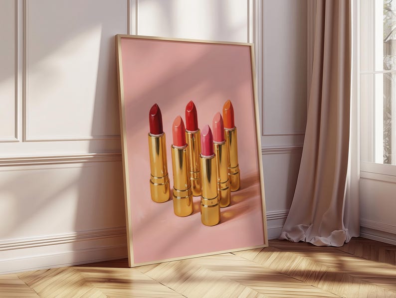 Retro makeup print with gold lipsticks in warm red and pink tones — vintage-inspired digital poster with soft shadows on a pastel pink background.