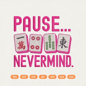 May include: An embroidery design featuring the hot pink text PAUSE... NEVERMIND. with four mahjong tiles in the center. The tiles display red, green, and black symbols. Below the text are seven orange buttons labeled PES, DST, EXP, JEF, VP3, HUS, and XXX.