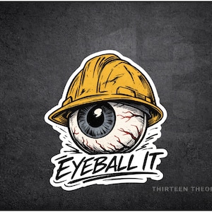May include: A sticker featuring a detailed illustration of an eyeball wearing a yellow construction hard hat. The text "EYEBALL IT" is below the eye, with "THIRTEEN THEORY CO" at the bottom. The design is set against a dark gray background.