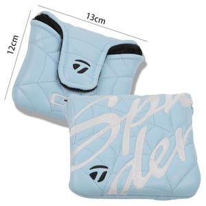 May include: Light blue golf club head cover, quilted with white stitching. The cover is approximately 12 cm by 13 cm. The cover has a black interior and a white embroidered "Spider" design. A black and white logo is visible.