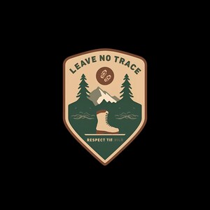 May include: A patch with a nature theme, featuring a mountain, trees, and a hiking boot. The text "LEAVE NO TRACE" is at the top, and "RESPECT THE WILD" is at the bottom. The design is in shades of brown, green, and white.