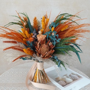 Könnte beinhalten: Ein Satz von drei Keramik-Nisttöpfen in Blau-, Grün- und Weißtönen. Die Schalen haben eine gesprenkelte Glasur und ein schlichtes Design. Die größte Schüssel hat einen Durchmesser von etwa 15 cm.