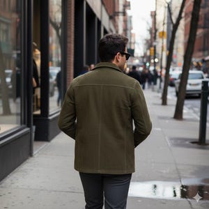 olive green suede jacket mens, men's matte suede coat, tailored suede jacket, slim fit olive jacket, urban suede outerwear, street style jacket men, casual button up suede, luxury men's coat, men's fall jackets, designer suede jacket, high quality men's jacket, men's flap pocket coat, slim fit men's clothing, unique men's jacket, stylish men's clothing