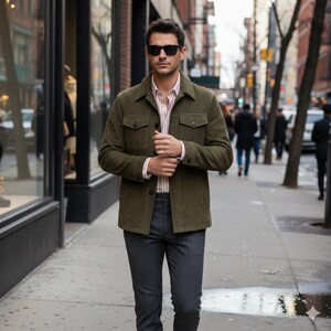 olive green suede jacket mens, men's matte suede coat, tailored suede jacket, slim fit olive jacket, urban suede outerwear, street style jacket men, casual button up suede, luxury men's coat, men's fall jackets, designer suede jacket, high quality men's jacket, men's flap pocket coat, slim fit men's clothing, unique men's jacket, stylish men's clothing