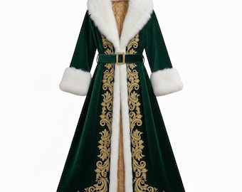 May include: A long, emerald green velvet coat with white faux fur trim on the collar and cuffs. The coat features gold embroidered detailing down the front and a matching belt with a gold buckle. The interior lining is a quilted gold fabric.