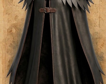 May include: A dark brown leather cloak featuring a high collar and a layered feather-like design at the shoulders. The garment is secured at the front with three brown leather straps and metal buckles, with a split front and pointed hemline.