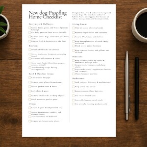 May include: A printed checklist titled "New dog-Proofing Home Checklist" with bullet points for home safety. The checklist is on a white paper, with a cup of coffee, a pen, and a plant on a wooden surface.