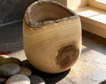 Hand-turned walnut vase with natural rim