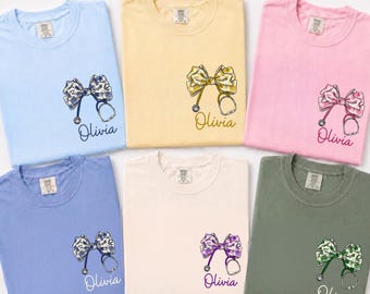 Comfort Colors® Custom Floral Nurse Shirt, Stethoscope Bow Tee, Coquette Nurse Shirt, Nurse Gift Shirt, Nursing School Tee, RN Shirt, GN238