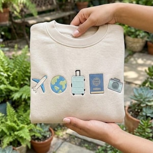 May include: A white ceramic mug with a black handle and the text "But First, Coffee" in a black, bold font. The mug is on a white surface. The mug is 10 cm tall.