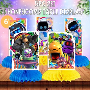 May include: A 5-piece set of honeycomb table displays. Each display features a colorful cartoon character design, with a 6-inch height. The displays are set on a wooden surface with blue and yellow honeycomb bases, and the text "5PC SET HONEYCOMB TABLE DISPLAY".