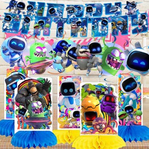 May include: A set of Astro Bot themed party decorations including a blue Happy Birthday banner and several cardboard centerpieces featuring various colorful robots, a gorilla, and alien creatures with honeycomb paper bases in blue and yellow.