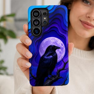 May include: A smartphone case featuring a black raven perched on a dark tree branch against a backdrop of a large, glowing purple full moon and layered, wavy shades of blue and violet that create a dimensional, paper-cut style effect.