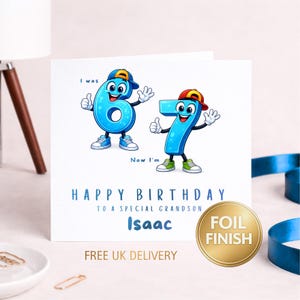 May include: A square birthday greeting card featuring cartoon number characters 6 and 7 wearing baseball caps and sneakers. The text reads I was 6, Now I'm 7, HAPPY BIRTHDAY TO A SPECIAL GRANDSON, and the name Isaac in blue font.