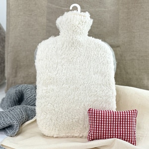 Hot water bottle cuddle with herbal pillow