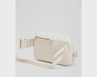 Riñonera Lululemon Everywhere 1L color marfil claro *NUEVA*