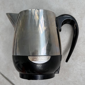 May include: A rustic wooden sign with the text "Welcome to our home" in white lettering. The sign features a distressed finish and a simple, inviting design, perfect for front door decor.