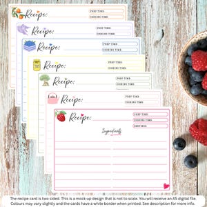 May include: A set of seven rectangular recipe cards with colorful borders and illustrations including oranges, lavender, blueberries, lemon curd, a tree, a kettle, and a raspberry. Each card features fields for Recipe, Prep Time, and Cooking Time.
