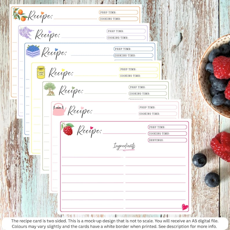 May include: A set of seven rectangular recipe cards with colorful borders and illustrations including oranges, lavender, blueberries, lemon curd, a tree, a kettle, and a raspberry. Each card features fields for Recipe, Prep Time, and Cooking Time.