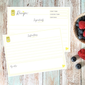 May include: Two white recipe cards with yellow borders and lemon jar illustrations. The top card features fields for Recipe, Prep Time, Cooking Time, Servings, and Ingredients. The bottom card includes an Instructions section and a My notes field.