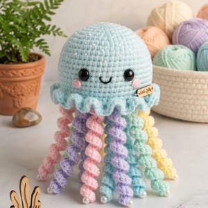 May include: A set of three ceramic mugs with a speckled, matte finish. Each mug features a different color: light blue, cream, and gray. The mugs have a simple, modern design with a rounded shape and a comfortable handle.