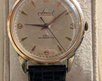 Reloj Accurist de cuerda manual de los años 50, 21 rubíes, en funcionamiento.
