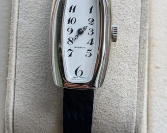 Very nice vintage tonneau ladies watch on blue strap