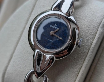 Hermoso reloj vintage para mujer con esfera azul y tono plateado