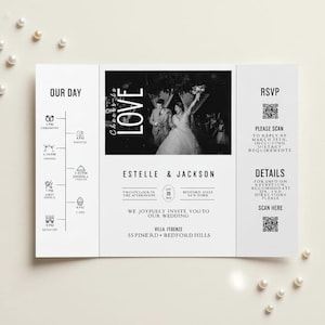 May include: A white wedding invitation with a black and white photo of a couple. The invitation includes the names Estelle & Jackson, wedding details, and RSVP information. Pearls are scattered around the invitation.