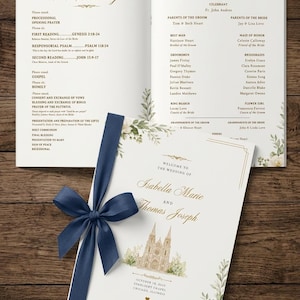 May include: A wedding program booklet featuring a white cover with a watercolor illustration of a chapel, green foliage, and a navy blue ribbon. The text reads Isabella Marie and Thomas Joseph, October 18, 2025, Starlight Chapel, Chicago, Illinois.