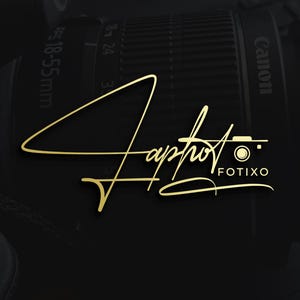 May include: A black Canon camera lens with the text "18-55mm" and a gold logo that reads "Japhot" with a camera icon and the word "fotixo". The logo is in a cursive font. The background is black.