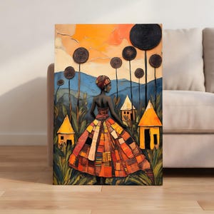 Peut inclure: Impression sur toile représentant une femme en robe patchwork colorée, debout dans un champ avec de petites maisons jaunes. L'arrière-plan présente des arbres stylisés, des montagnes et un ciel orange et bleu vif. L'œuvre a un aspect peint texturé.