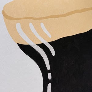 May include: Abstract art print featuring a stylized design. The artwork showcases a tan, rounded shape at the top, transitioning to a black form below. White, curved lines add contrast against the dark background.