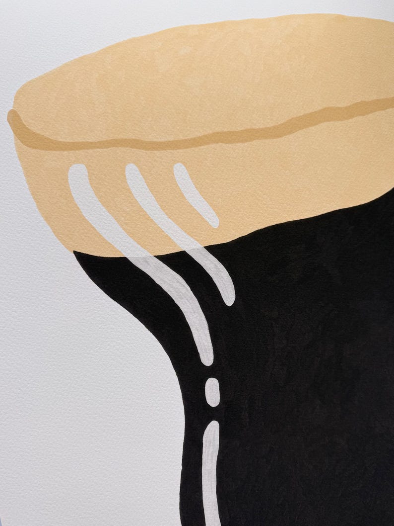 May include: Abstract art print featuring a stylized design. The artwork showcases a tan, rounded shape at the top, transitioning to a black form below. White, curved lines add contrast against the dark background.