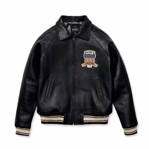 May include: A black leather jacket featuring a front zipper closure, a classic collar, and two side pockets. On the left chest, there is a patch displaying the text AVIREX above a shield with a red, white, and blue flag design. The cuffs and hem are ribbed with black, white, and red stripes.