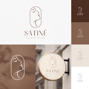 Puede incluir: Un logotipo de salón de belleza que presenta un dibujo lineal minimalista del perfil de una mujer dentro de un marco ovalado. El nombre del salón, "SATINÉ BEAUTY SALON", se muestra en una tipografía elegante. El logotipo se presenta en varios esquemas de color.