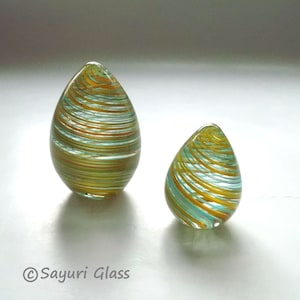 Set of Two Glass Egg Paperweight Yellow Teal Mica Canes:  DISASTER RELIEF