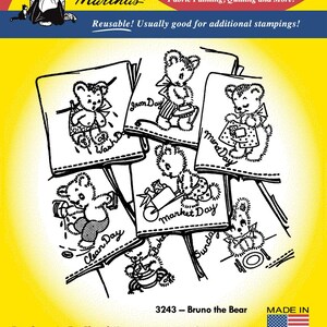 Könnte beinhalten: Bügeleisen-Transfermotive mit einem Bären und verschiedenen Sprüchen wie "Iron Day", "Mend Day", "Clean Day" und "Market Day". Die Motive stammen von Aunt Martha's und sind wiederverwendbar. Das Bild enthält auch den Text "3243 - Bruno the Bear" und "Made in U.S.A."