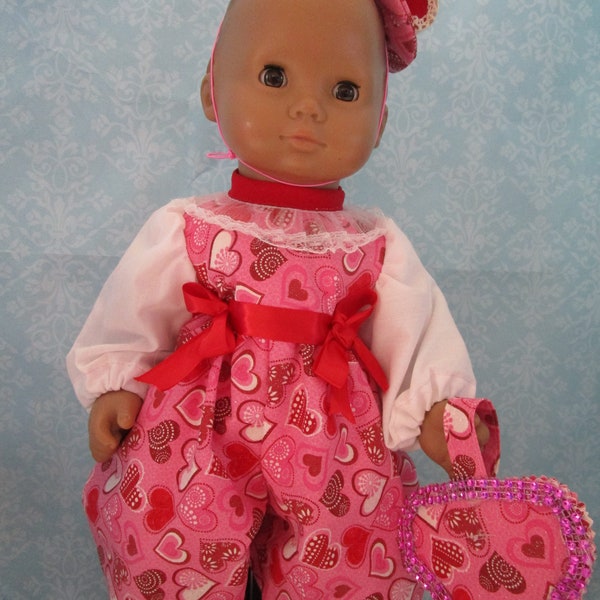 Valentine print romper with matching hat and heart shaped purse. Fits 15-inch doll such as Bitty Baby and Bitty Twins,