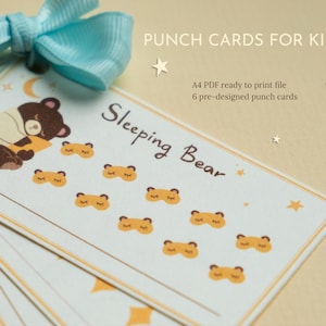 May include: A set of "Sleeping Bear" punch cards for children, with a cartoon bear and sleep mask designs. The cards are accompanied by a light blue bow and text that reads "PUNCH CARDS FOR KIDS" and "A4 PDF ready to print file".