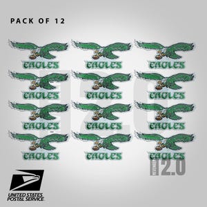 May include: A pack of 12 embroidered patches. Each patch features a green eagle with a football and the word "EAGLES". The United States Postal Service logo is visible. The text "PACK OF 12" is at the top.